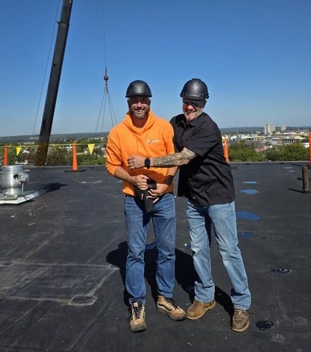 RoofMasters team members on rooftop